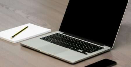 Free Silver Macbook Beside Iphone Stock Photo