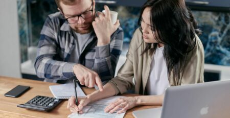 Free couple calculating al their bills stock photo