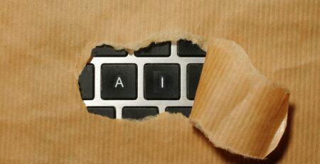 A piece of cardboard with a keyboard appearing through it