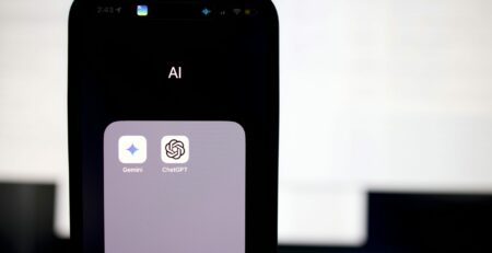 a close up of a cell phone with an ai button