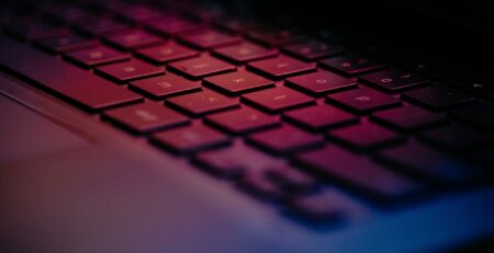 a-close-up-of-a-keyboard-with-a-blurry-background